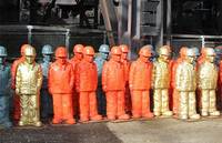 Figuren in Arbeitskleidung